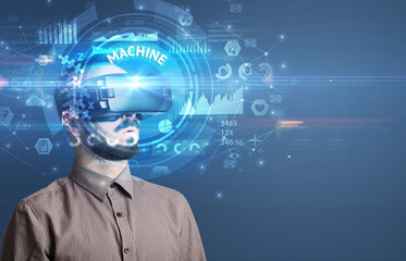 Businessman looking through VR glasses