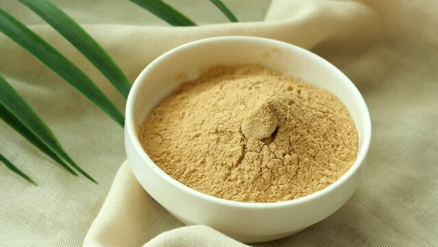 brewers yeast flakes in a bowl on table 