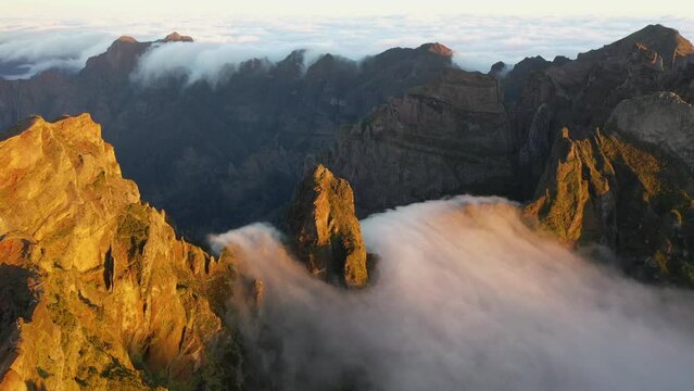 Great aerial footage in 4K of a rock in Madeira called Ninho da Manta with the fog coming through.