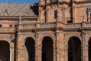 Obraz premium Architectural details of the picturesque renaissance and Moorish building styles in the Spain square (Plaza de Espana). Seville, Andalusia, Spain.