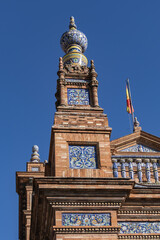 Architectural details of the picturesque renaissance and Moorish building styles in the Spain square (Plaza de Espana). Seville, Andalusia, Spain.