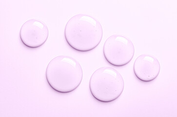 Pink drops of moisturizing gel or serum. Cosmetic product for skin care