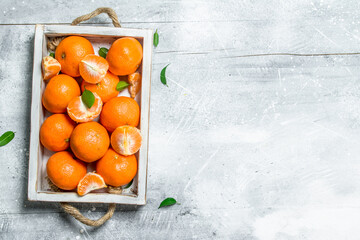 Fresh mandarins in the tray. - 561314058