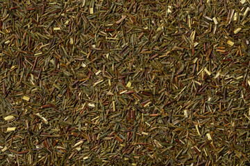 South African green Rooibos tea leaves close up full frame as background