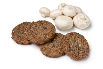 Fresh baked champignon burgers and mushrooms close up isolated on white background