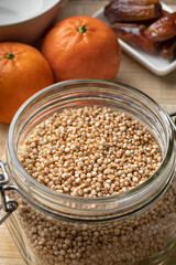 Glass bowl with healthy puffed quinoa close up as an ingredient for breakfast  
