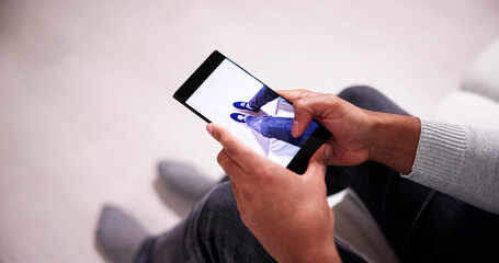 Man Trying Virtual Sneakers In Shop