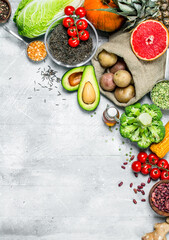 Healthy food. Assortment of organic vegetables and fruits with legumes.