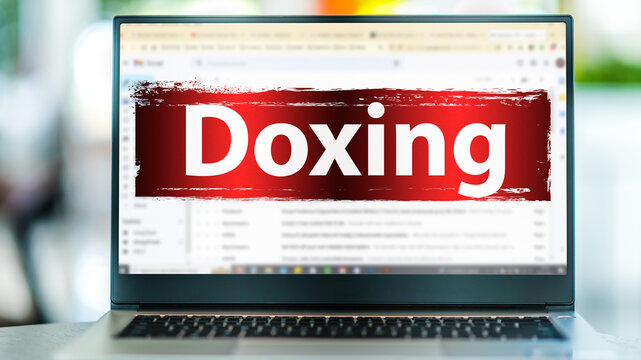 Laptop displaying the sign of doxing on the internet