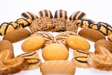Cookies on a white isolated background. Layout, assorted different cookies and different colors.