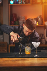 Bartender squeezes lemon