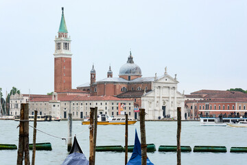 MAY 20, 2017 - VENICE, ITALY: Close up of San Giorgio Maggiore church with ships transporting people around it.