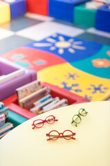 back to school concept with colored glasses and books