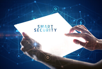 Holding futuristic tablet, security concept