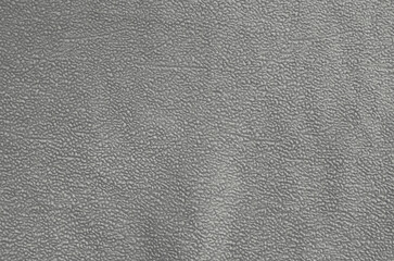 An abstract surface of old gray synthetic fabric.