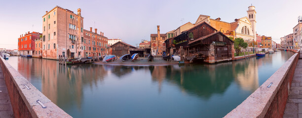 Venice. Old colorful houses over the canal in the early morning.
