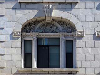 Detail of beautiful Classic Venetian window and white tiled facade in San Francisco. California....