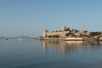 Beautiful seascape view of Bodrum Castle with Yachts in the harbor of the Aegean Sea, south west Turkish coastline, Turkey.