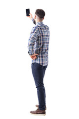 Back view of adult man taking photo or selfie with smartphone. Full body isolated on transparent background.
