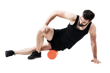 Athlete massaging and stretching iliotibial band muscle with foam roller. Full body length portrait isolated on transparent background.