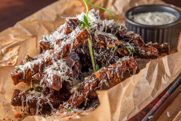 Deep fried rye croutons with grated parmesan cheese and garlic