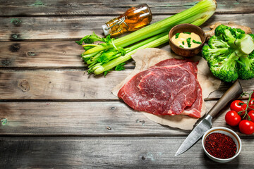 Healthy food. Raw beef with a variety of organic food and spices.