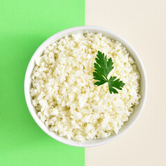 Raw cauliflower rice in bowl