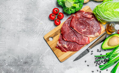 Organic food. Variety of healthy food with beef steaks .