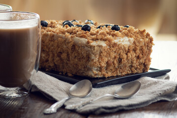 still life honey cake decorated with blueberries