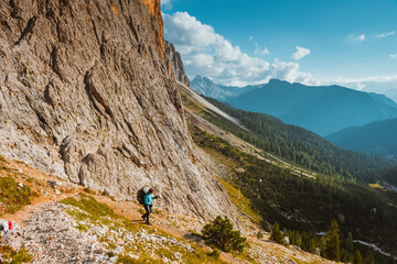 Fototapeta na wymiar hiking sport woman in mountains Sella Ronda, Dolomites, Italy