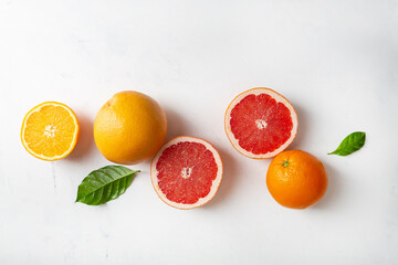 Food background with sliced fruits top view orange grapefruit