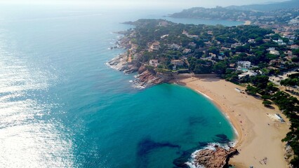 aerial view of bay with the beach Cala sa Conca in S'Agaró an upmarket resort on the Costa Brava between Sant Feliu de Guíxols and Platja d'Aro with exclusive houses and hotels, Catalonia, Spain