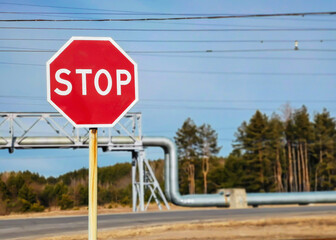 A road sign on the background of an industrial landscape.