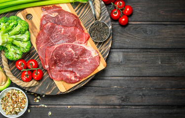 Healthy food. Raw beef meat with organic food assortment .