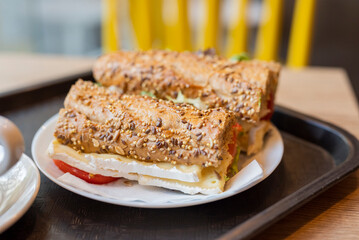 breakfast in the restaurant bread with filling sandwich with a cup of coffee