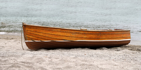 Lonely boat on a deserted beach. Loneliness, freedom, relaxation, tranquility, peace, well-being,...
