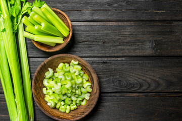 Pieces of celery in a wooden bowl.