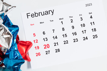 President's Day. Date on calendar February 20, 2023. Red, blue and white star balloon, decorations...