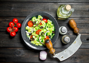 Vegetable salad. Salad of cucumbers, tomatoes and red onions with spices and olive oil.