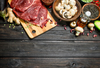 Healthy food. Raw beef with a variety of organic food and spices.
