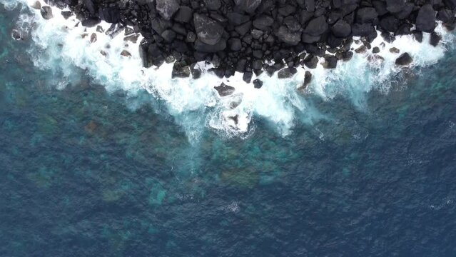 Top View of rocky shore and Lighthouse Farol Ponta do Arnel on San Miguel Island, Azores islands