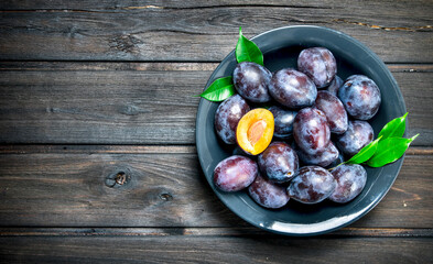 Fresh ripe plum on a plate.