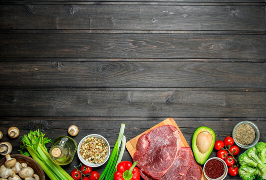Healthy food. Raw beef meat with organic food assortment .