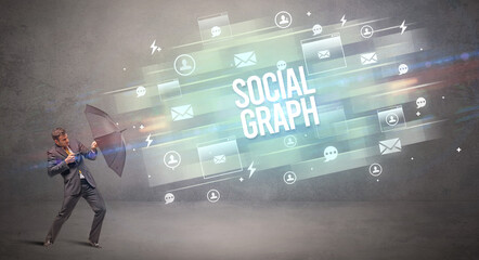 businessman defending with umbrella concept