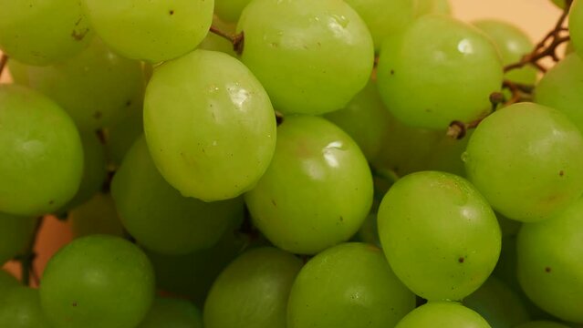 Rotating green grapes. Ripe green grapes.