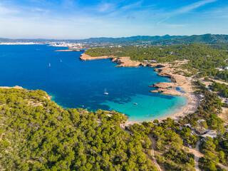 Fototapeta na wymiar Ibiza Cala Bassa beach with turquoise water, aerial views