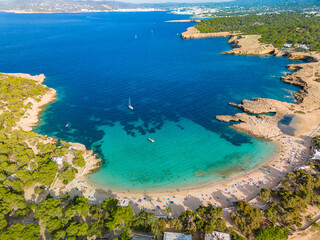 Fototapeta na wymiar Ibiza Cala Bassa beach with turquoise water, aerial views