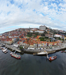 Fototapeta na wymiar Aerial view of the old city of Porto. Portugal old town ribeira aerial promenade view with colorful houses. High quality photo
