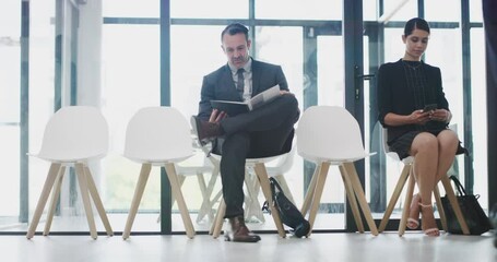Business people, sitting and waiting room for interview, meeting or corporate recruitment at workplace. Group of employee candidates waiting for team discussion or hiring for company growth at office