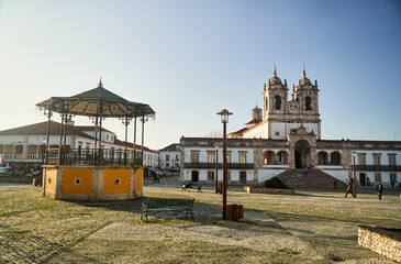 Nazare, Portugal - 27.12.2022: The central square of Nazare with pavilion and Nossa Senhora da Nazare Church on the background. Portugal. High quality photo